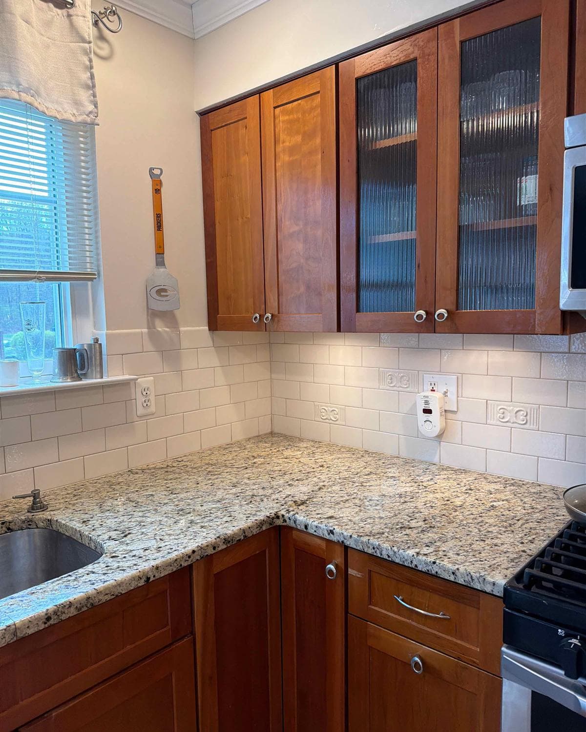 Cleaned kitchen with granite countertop, stainless sink, and white subway tile backsplash in Hackettstown, NJ