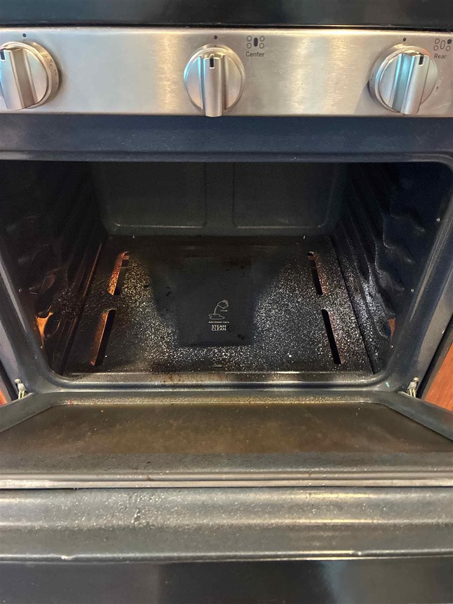 Oven interior with baked-on grime before cleaning in Hamburg, NJ
