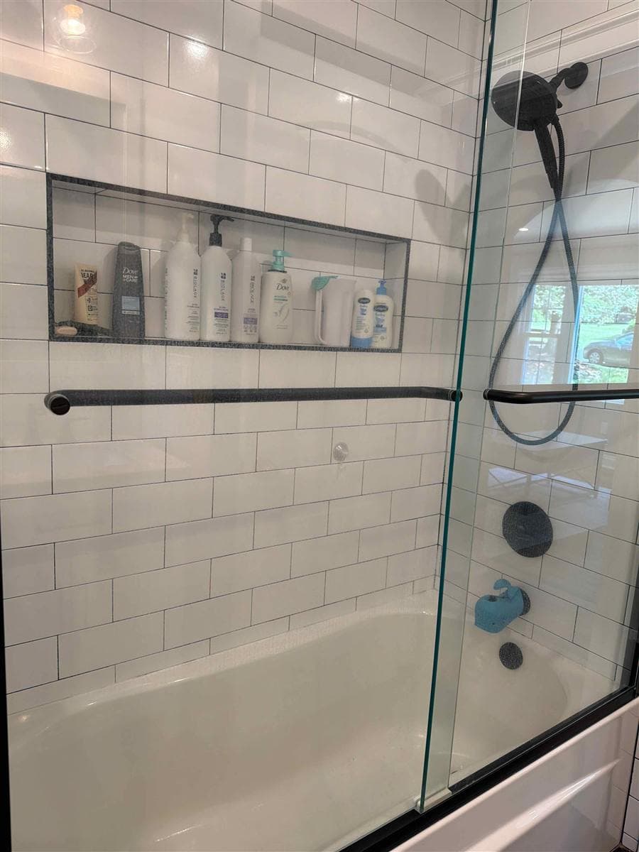 Streak-free glass shower enclosure and clean bathtub after cleaning in Rockaway, NJ