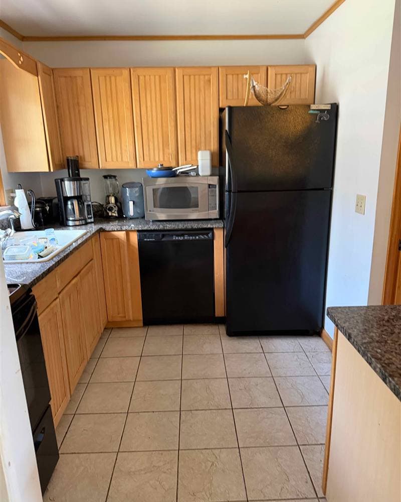 Clean kitchen with appliances and freshly mopped tile floor after a house cleaning in Sparta, NJ