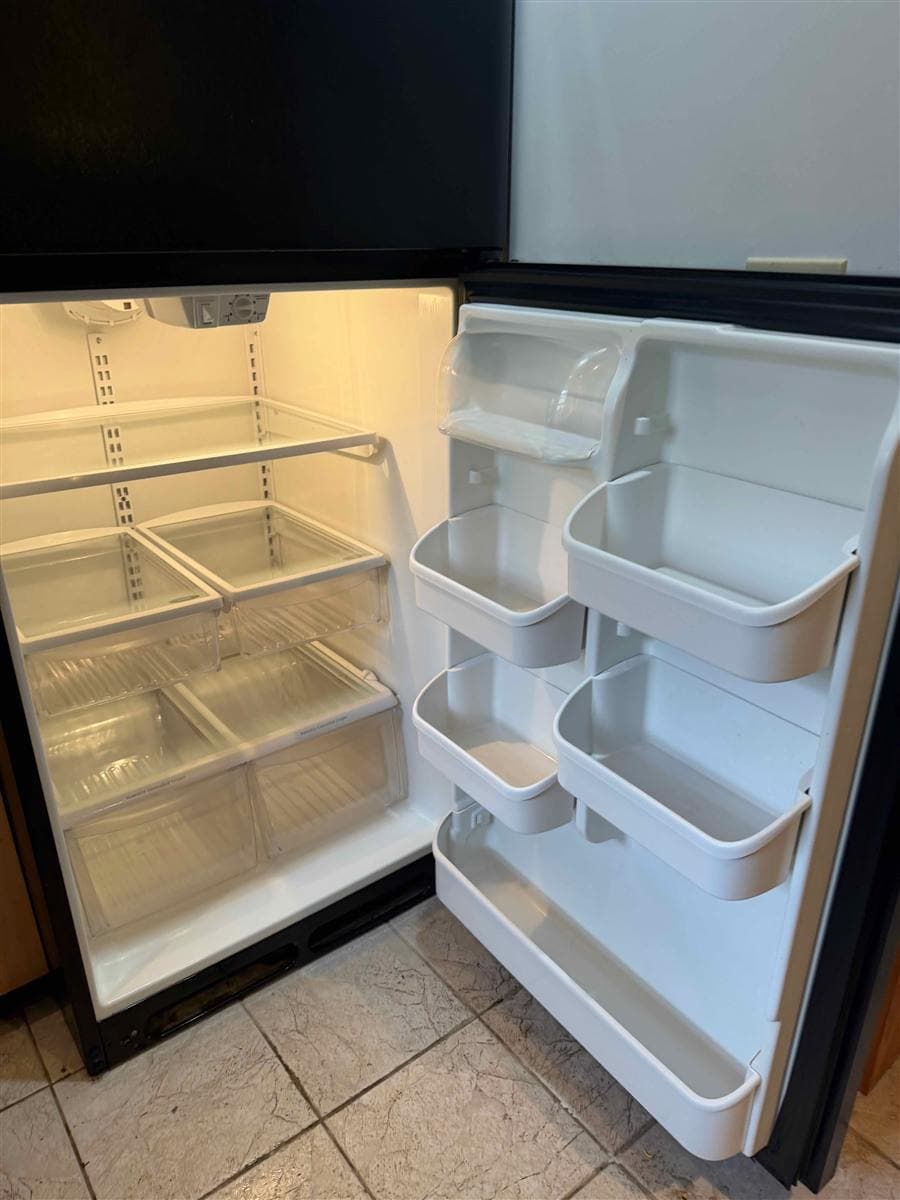 Empty, spotless refrigerator interior after a deep clean in Sparta, NJ