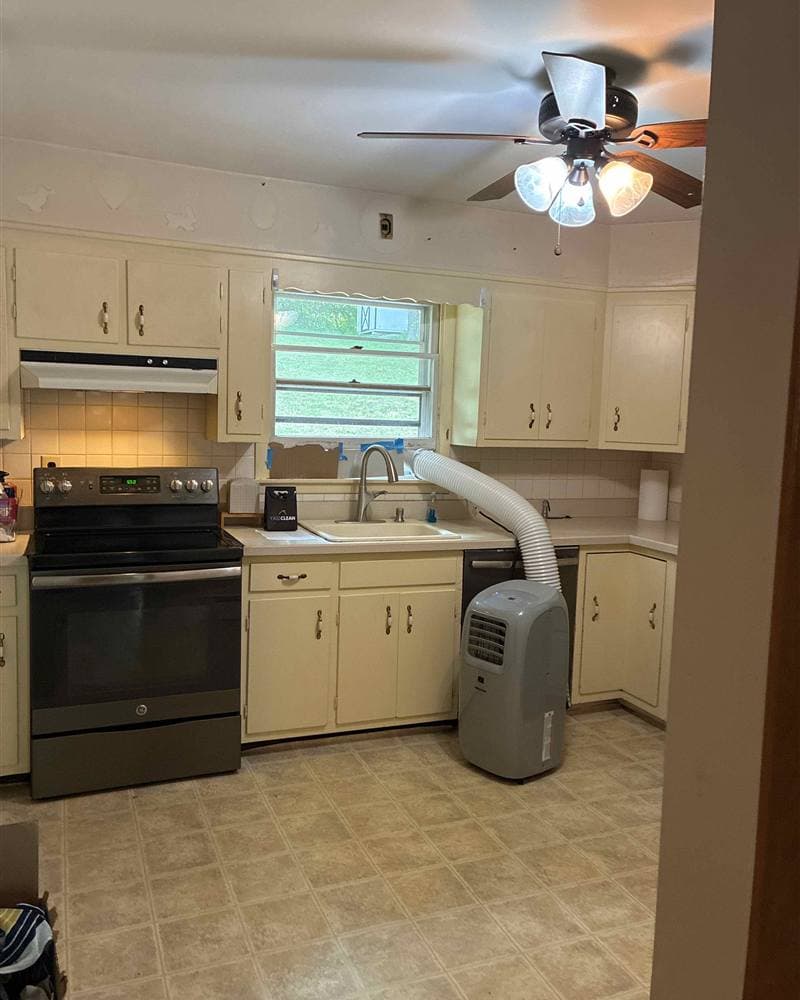 Cleaned kitchen with wiped counters, sink, and stove after a residential cleaning in Newton, NJ